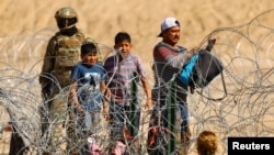 Migrantes en la frontea entre ciudad Juárez, México, y Texas, Estados Unidos. (REUTERS /José Luis González/File Photo).